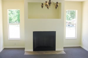 Living room featuring a built-in fireplace, decorative wall niche, and soft neutral wall colors.