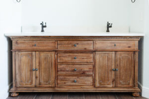 custom wood vanity with dual sinks in country style bathroom