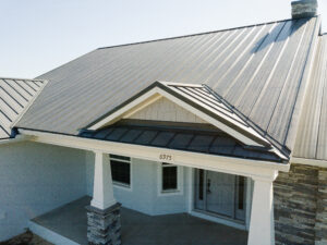 front porch with columns and metal roof on custom country home