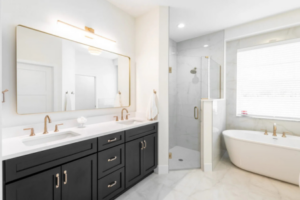 Elegant custom bathroom with double vanity, walk-in shower, and soaking tub in a Curington Homes build