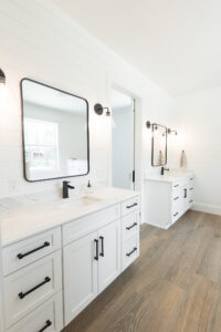 Custom bathroom with double sink vanity, black fixtures, and modern farmhouse design in Morriston Florida