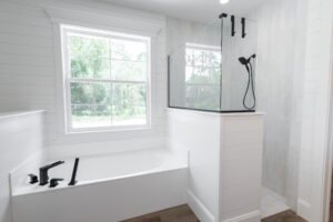 Luxury bathroom with freestanding soaking tub and glass shower in Morriston Florida custom home