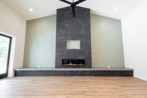 Modern stone fireplace feature wall in a custom home living room in Ocala Florida