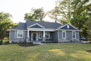 Modern country-style custom home in Ocala Florida with spacious yard and clean exterior design