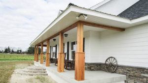 The front porch of a farmhouse style home in Ocala, Florida